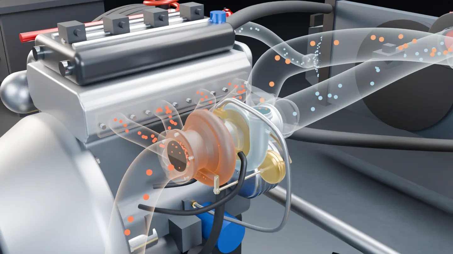 The engine bay with the turbocharger: orange exhaust flows into the turbine, blue air leaves the compressor.